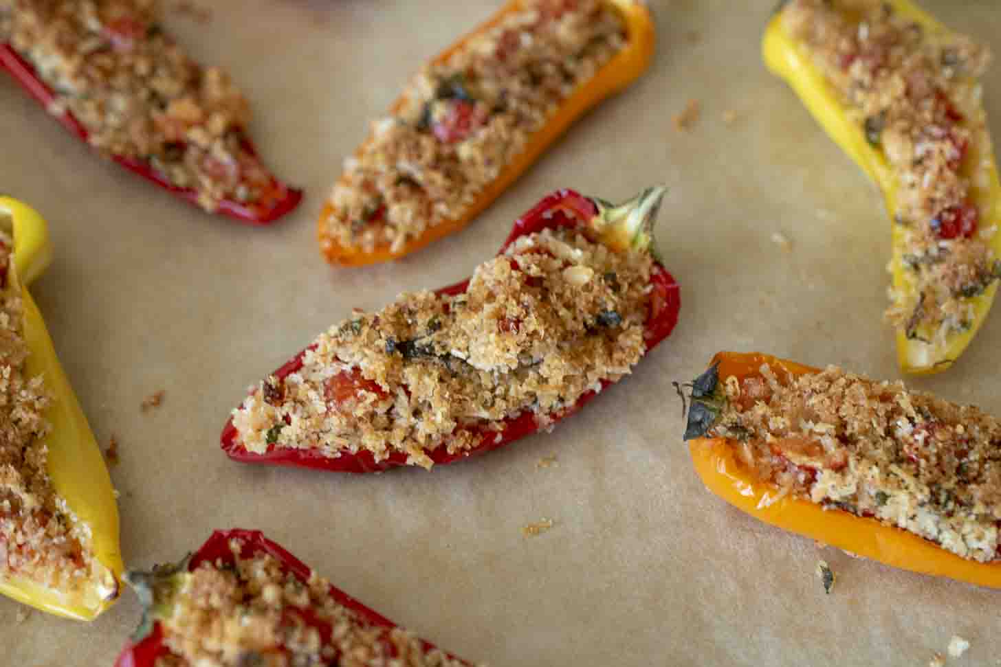 Baked mini peppers stuffed with parmesan and breadcrumbs